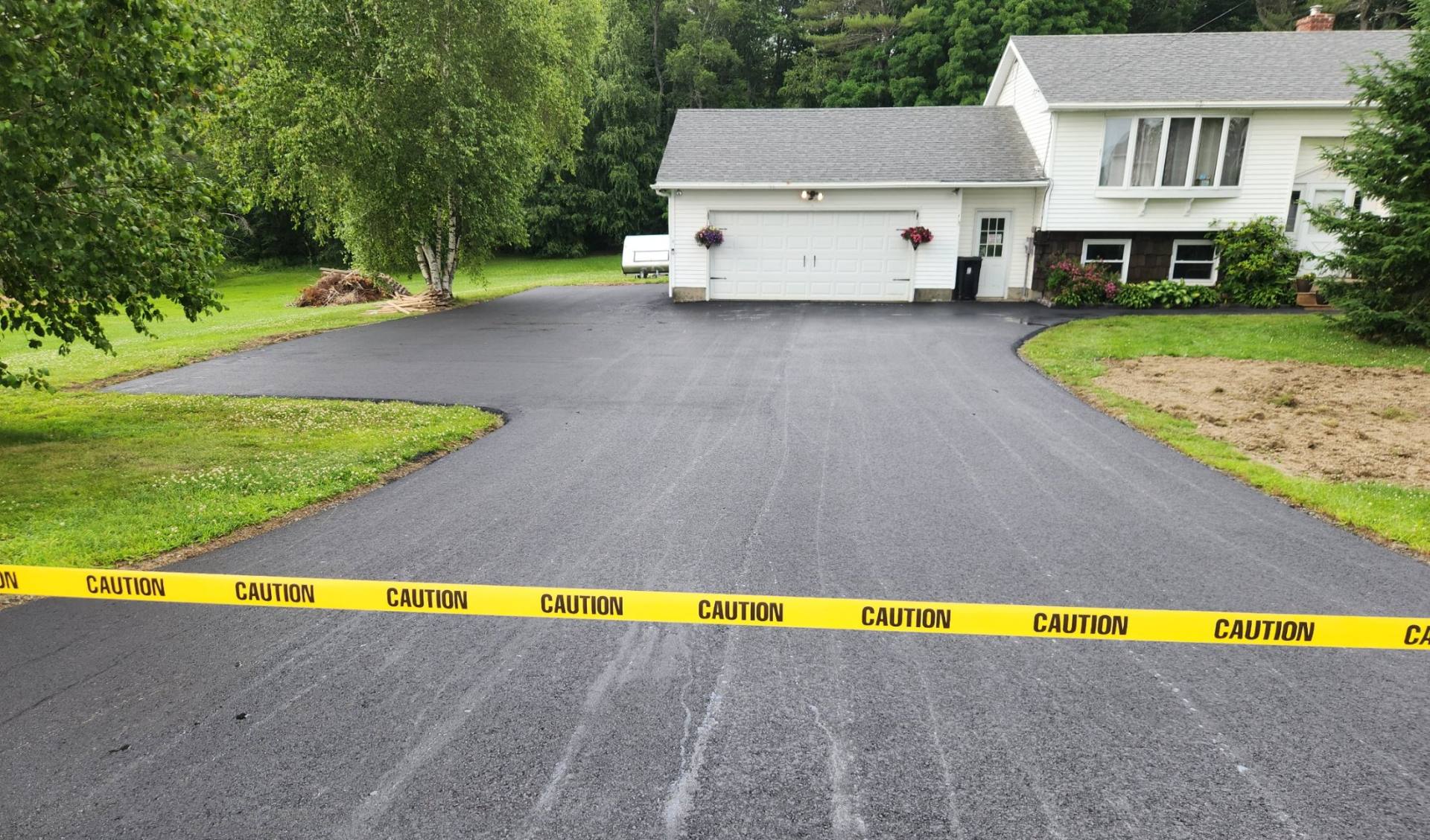 New driveway with the caution tape still across it
