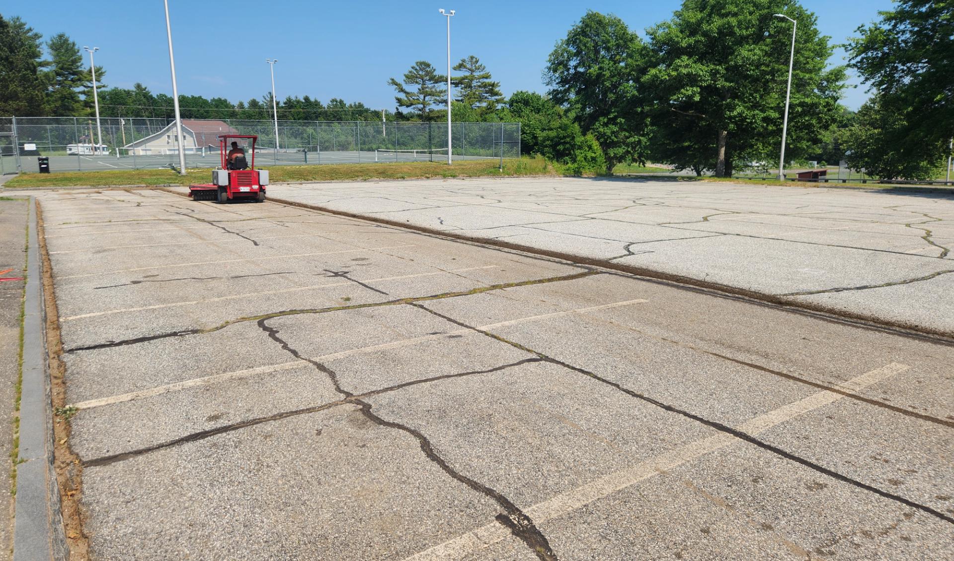 School parking lot with a heavy crack pattern